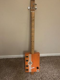 Three string electric cigar box guitar with amp