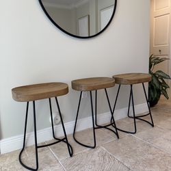 Three restoration hardware 1950s oak tractor seat counter height kitchen barstools, chairs, RH.