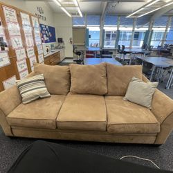 Living Spaces Couch And Ottoman 