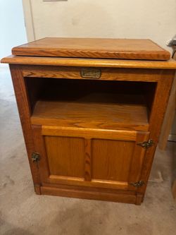 Solid oak cabinet has a white clad Simmons