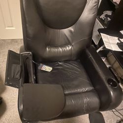electric recliner massage chair with table and cup holders.