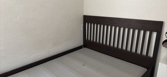 IKEA dark wood bed frame