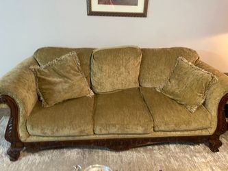 Beautiful wooden accent, chase lounge, and couch