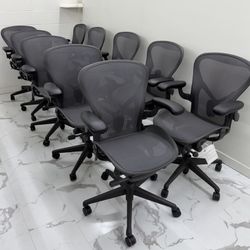 BRAND NEW HERMAN MILLER REMASTERED AERON CHAIRS SIZE B, GRAPHITE COLOR WITH ADJUSTABLE ARMS.
