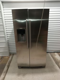 Beautiful stainless steel side by side refrigerator in excellent working condition