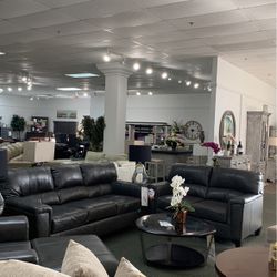 Four piece sofa loveseat chair and ottoman