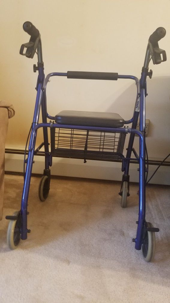 Very nice Walker with seat and hand brakes. Excellent like new