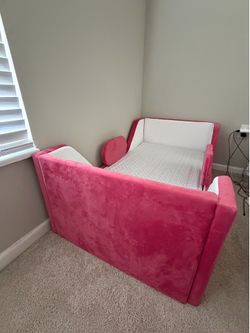 Pink toddler bed w/ new newton mattress