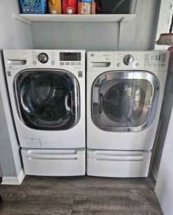 LG Front Load Washer and Dryer Set with Bottom Storage Stands