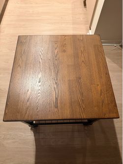Two brown wood tables for sale in good condition