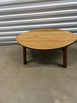 IKEA Stockholm coffee table features a distinct leaf-shaped light wood top