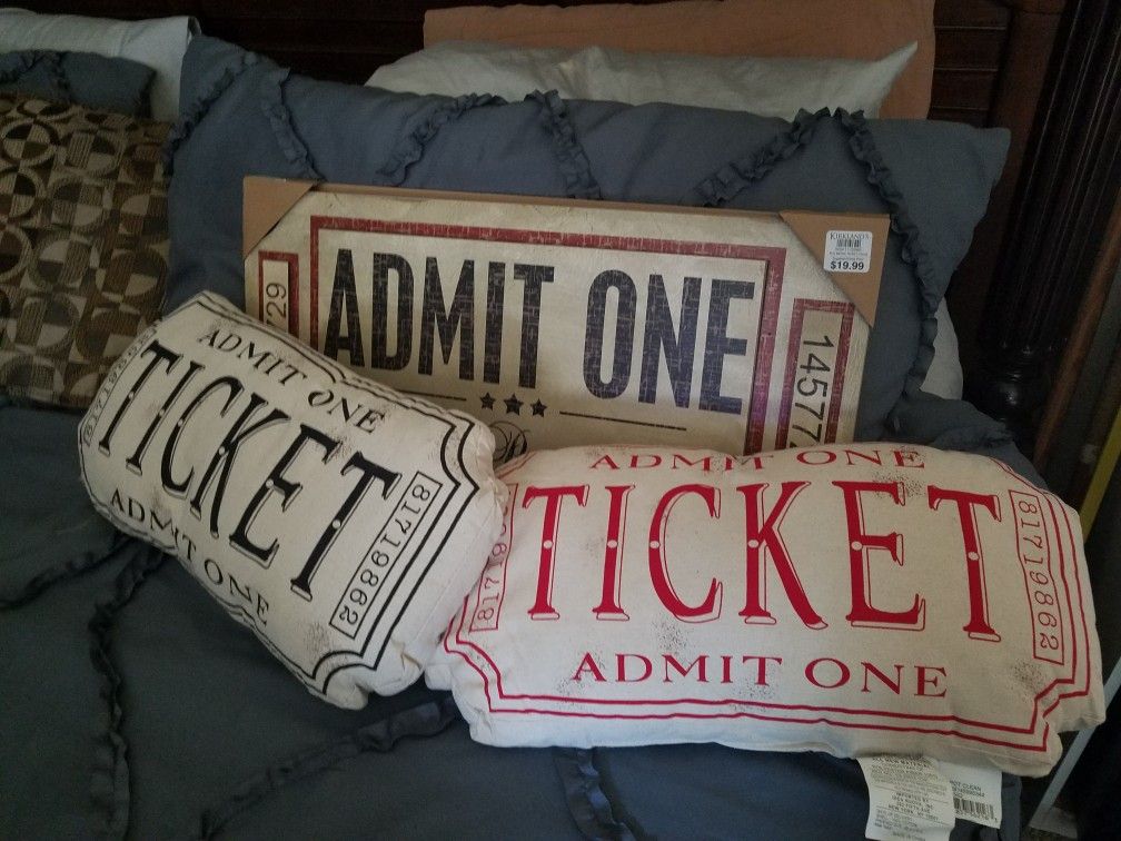 Movie ticket sign & pillows.