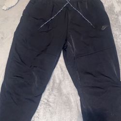 Nike tech pants ( not Fleeced ) It’s A 100% Polyester 