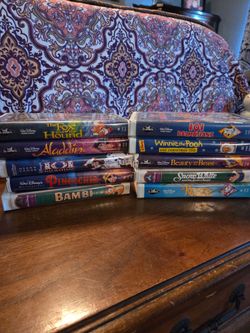 9 VHS DISNEY movies in clamshells