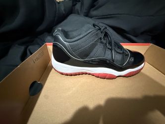 Red and black Jordan 11s