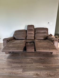 Reclining leather couch built in charging stations