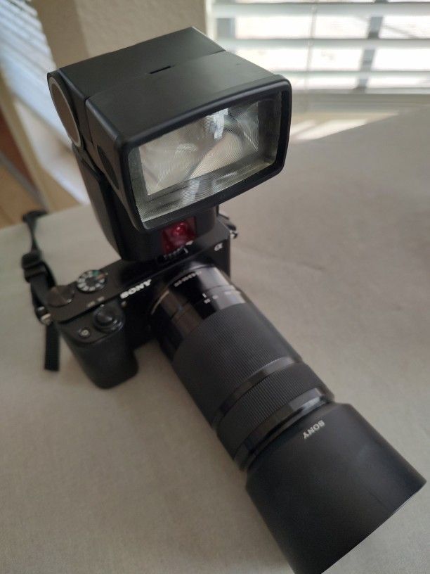 ony Alpha a6000 Mirrorless Digital Camera w/ 16-50mm and 55-210mm Power Zoom Lenses Black