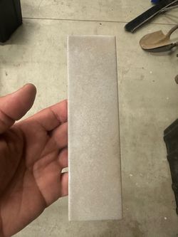 American Olean Conrad Brick, 2” × 8” glazed porcelain wall tile. The box label appears to be CB91 / RCT28GL, color 64007 (Linen).