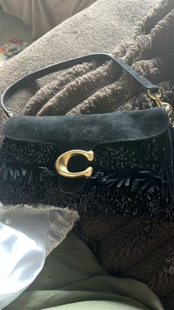 New with tags coach with dust bag, sequence, and fringe