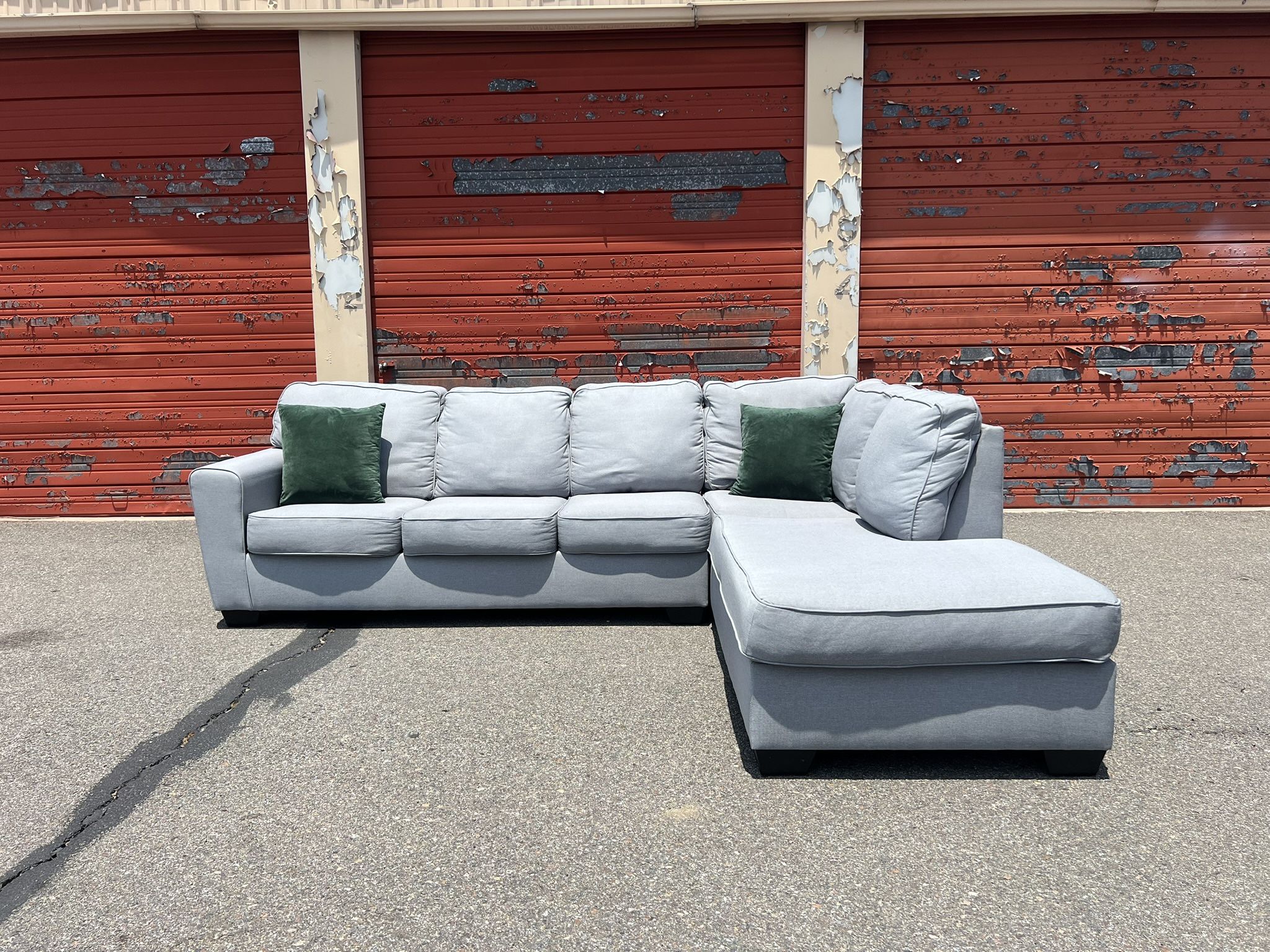 Ashley’s Gray Sectional Sofa Couch with right facing chaise