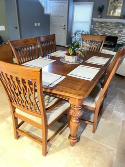 Tommy Bahama dining table and 6 chairs