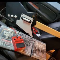 Playstation 3 guitar with dongle it's for guitar hero and rockband works for both
Comes with 3 games
