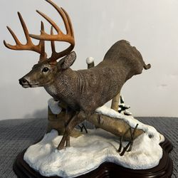 Deer winter scene sculpture
