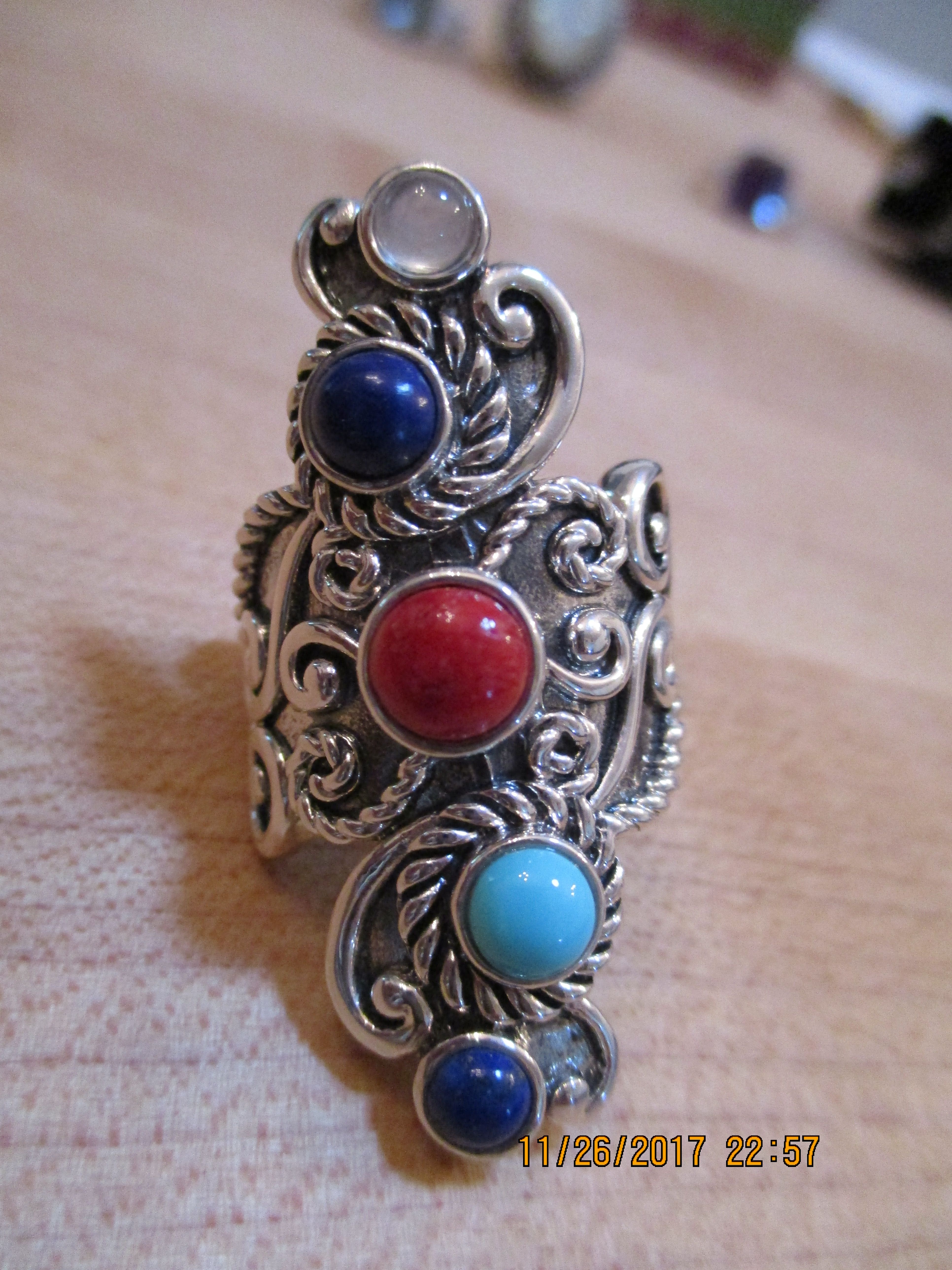 Silver with lapis, red coral, moonstone, turquoise stones