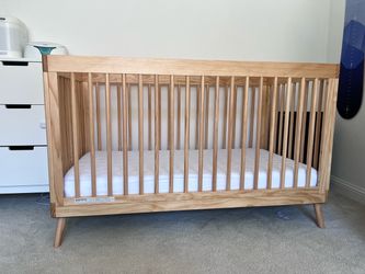 Wooden crib with mattress