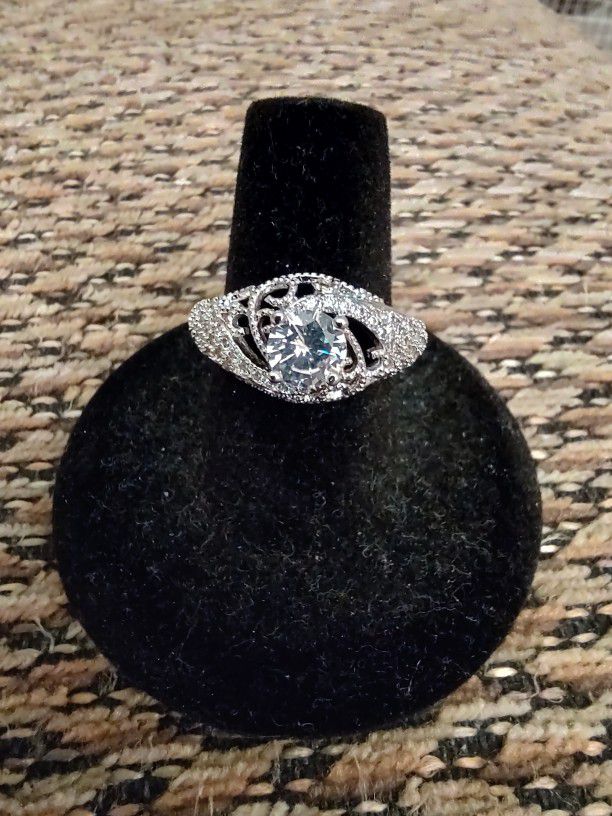 STERLING SILVER CZ RING.  SIZE 7.  NEW. PICKUP ONLY