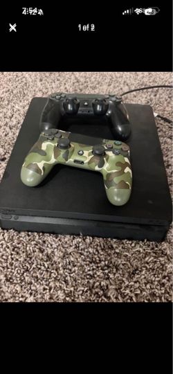 PS4 with 2 controllers and 3 games