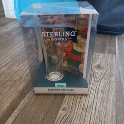 sterling goods glass cup qnd book. 