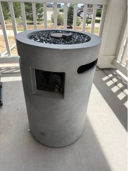 Modern outdoor propane fire pit with tank/black fire glass