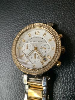 Women’s Michael Kors watch with diamonds.