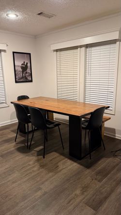 Dining room with a bench and 4 chairs
