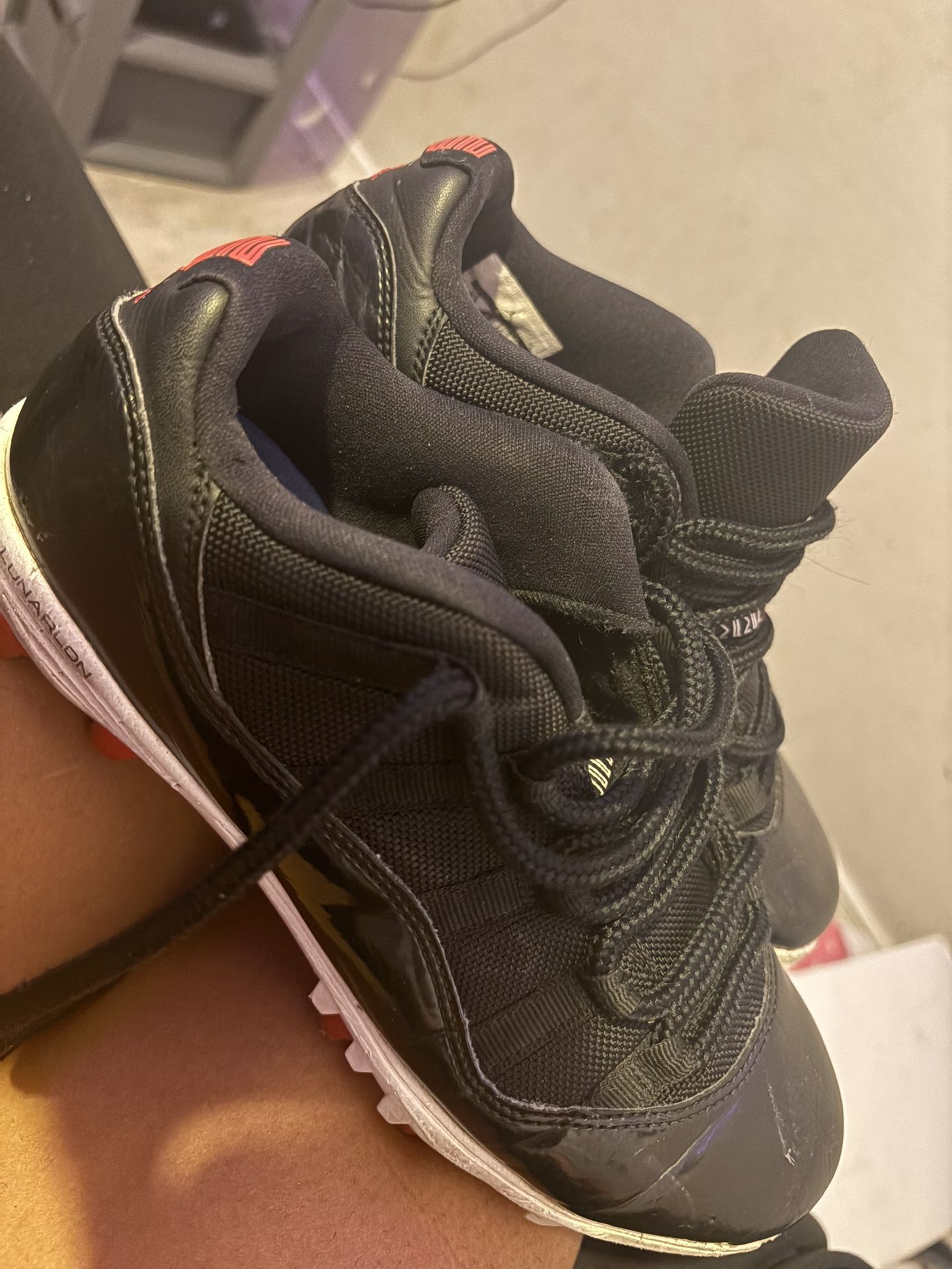 jordan 11 red/black low cleats