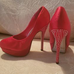 RED STUDDED HEELS