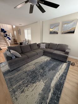 L Sectional couch with pullout bed - Living spaces