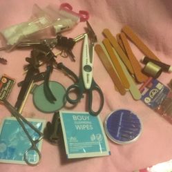 3 Nail  Two Staple Clip    14    Nail File  Three Sissors   Nail Brush    One Little Mirror   One Razorb Bone Twitter   Three Toe Nail Clipper  