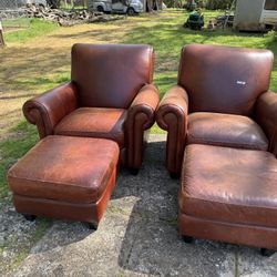 Two Chairs With Ottomans