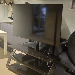 Roku 65in TV With TV Stand 
