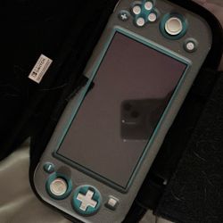 Nintendo Switch LITE with Case, 2 Games & 128gb SD Card. Will Turn On And Show It Works, Etc