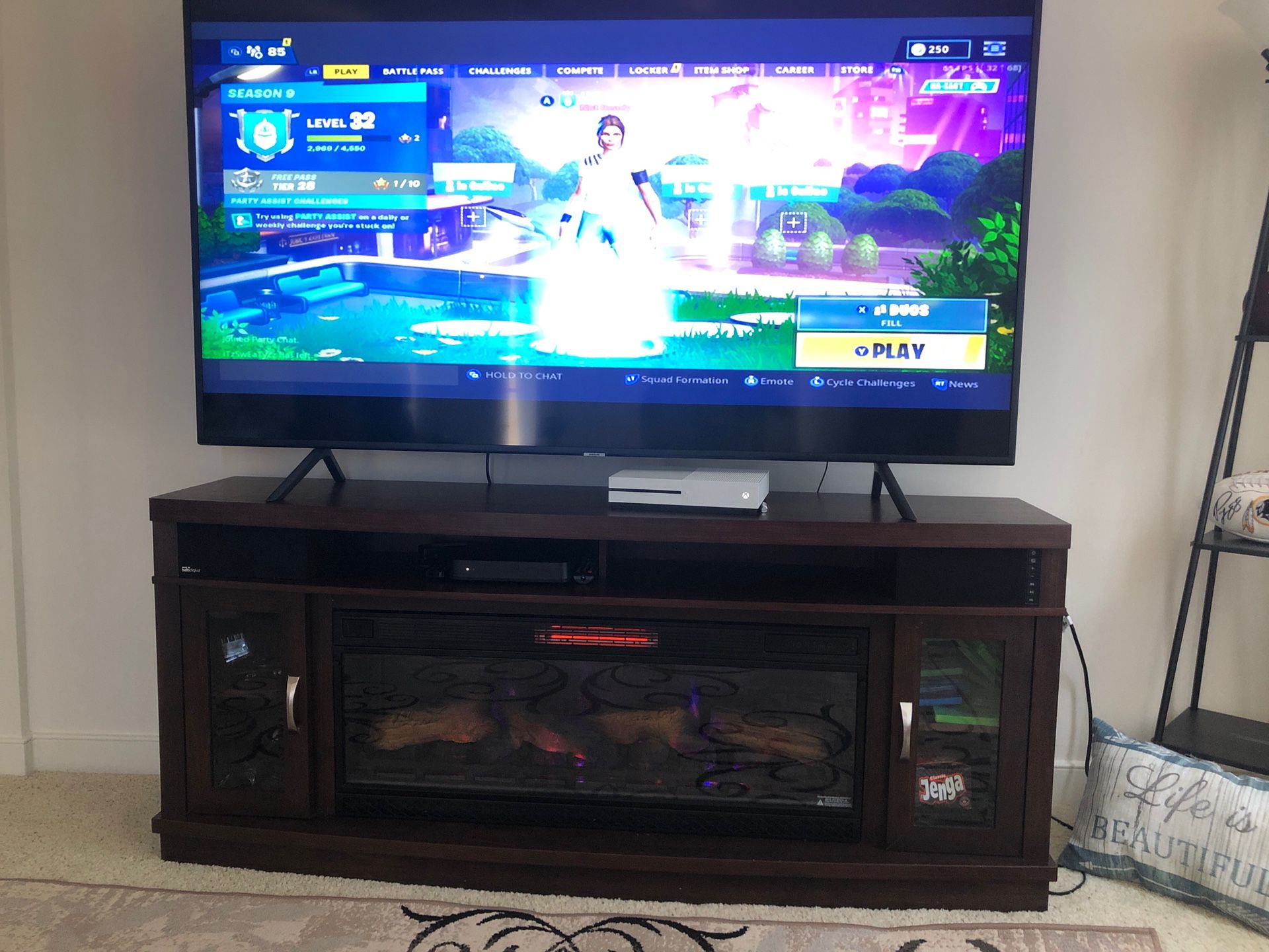 75in Samsung 4K smart tv and a electric fire place