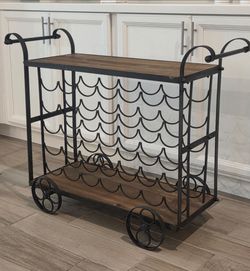 Wood and Metal Rolling Bar Cart. Used, in good condition. It hold 35 Bottles.
40"W from outer handles x 14"D x 30.5"H
$65
Must pick up near Old Ri