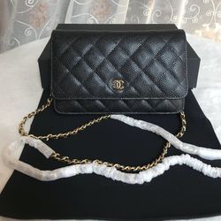 WOC in caviar black with gold hardware