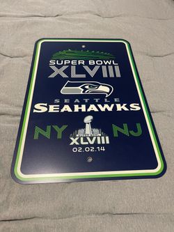 Seahawk Super Bowl XLVIII champion signs.