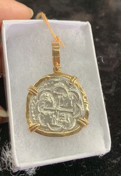 Atocha silver coin pendant in gold bezel
