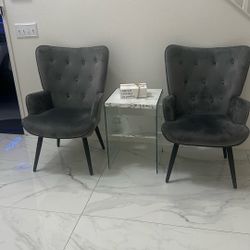 Two Chairs And Coffee Table With A Small Table