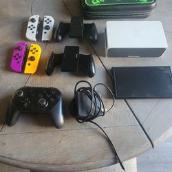 Nintendo switch (oled) with 1 joy controller, charging dock and pro controller. Carrying case included
