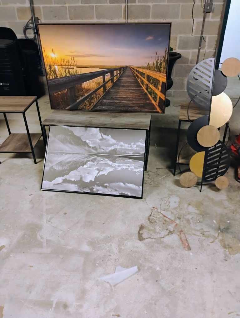 Coffee table with 2 end tables with 3 pictures. 